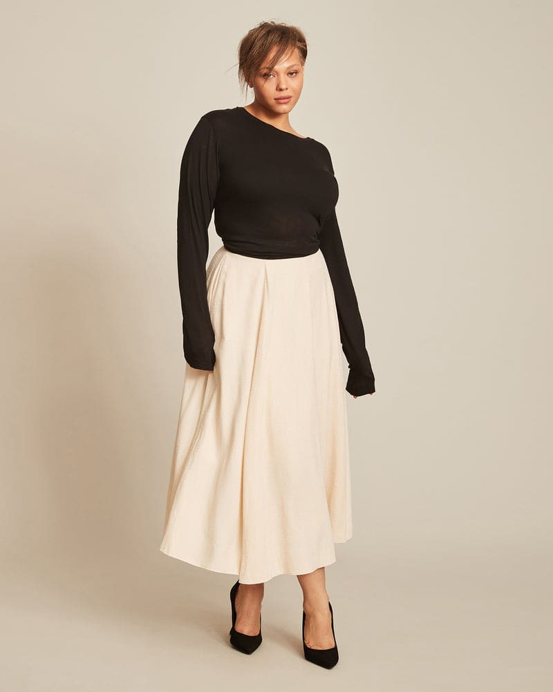 Front of a model wearing a size 14 Farrah Skirt in Natural by 11 Honoré Collection. | dia_product_style_image_id:218855